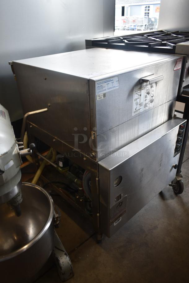 Commercial stainless steel dishwasher with control panel and visible plumbing. Labels indicate operating instructions. Good condition.