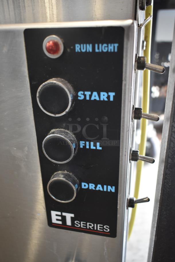 Close-up of ET Series machine control panel with buttons labeled Start, Fill, Drain, and Run Light indicator.