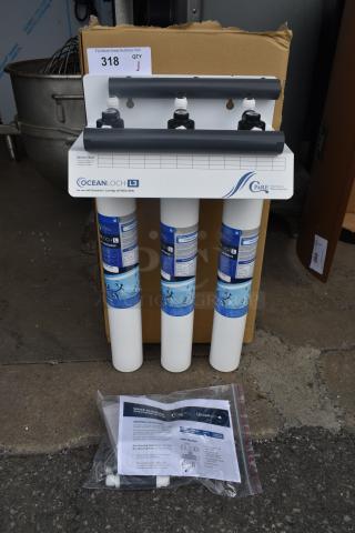 Ocean Loch L3 water filtration system, includes three cartridges, installation guide, and fittings. New condition, lot 318.