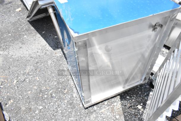 Aluminum utility cabinet with a blue protective film on top, hinges, and latches, in excellent condition.