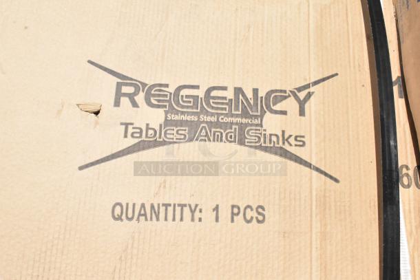 Regency stainless steel commercial table and sink packaging, marked "Quantity: 1 PCS." Slight tear on the cardboard.