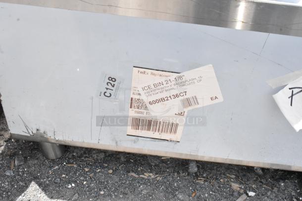 Stainless steel ice bin with labels showing dimensions 21-1/8", 15-3/16"x34"x8" bowl, in used condition with some wear.