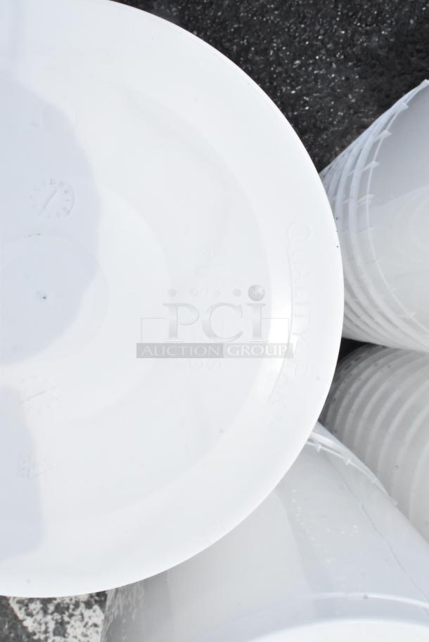 White plastic bucket with lid, marked "Quality-Pak, 3.5 US Gals." Good condition, suitable for storage or mixing.