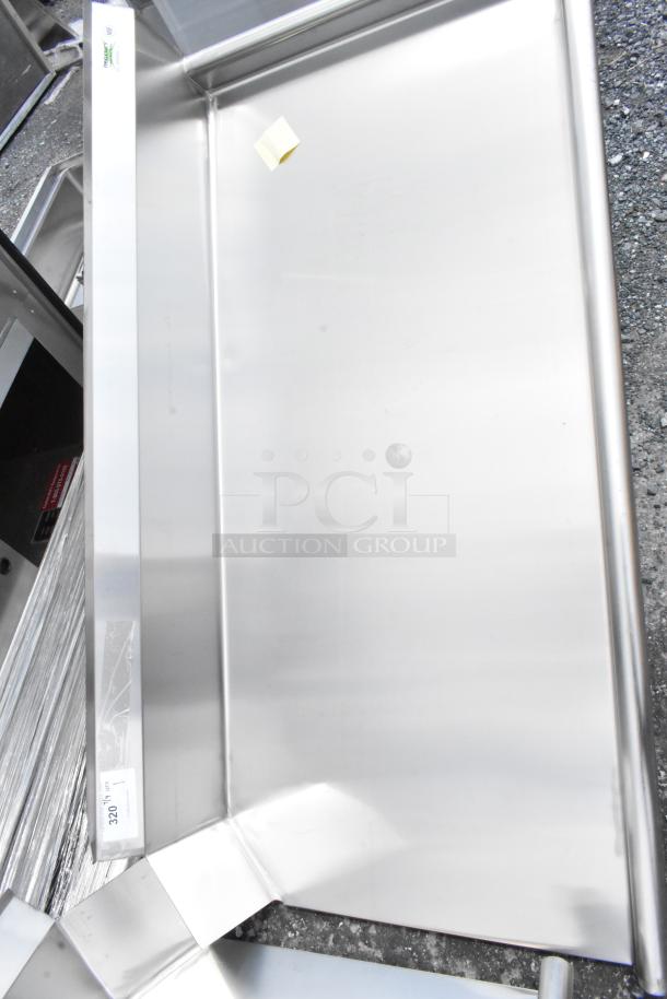 Stainless steel rectangular sink, unused condition, slight reflections visible. Label on edge with number 320.