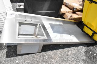 Regency stainless steel sink with left-side splash and drainboard, NSF certified. In good condition with slight wear.