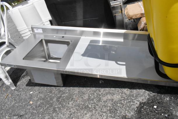 Stainless steel Regency sink with prep area, excellent condition, model tag visible, ideal for commercial kitchens.