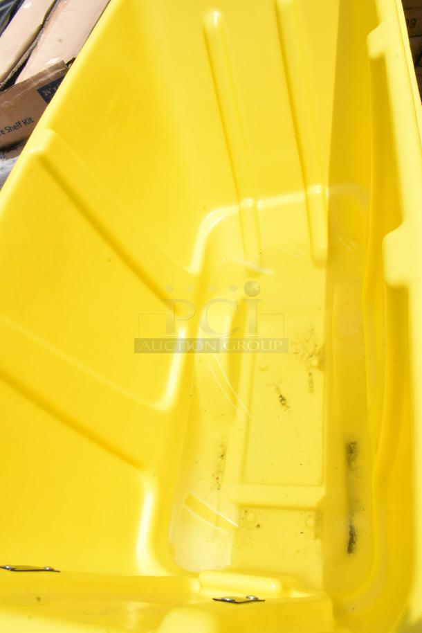Yellow plastic tub, deep interior, minor dirt at bottom, used condition, sturdy with reinforced sides.