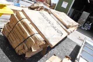 Damaged boxes of Lancer items, with straps and visible labels; condition indicates possible contents for auction sale.