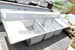 Stainless steel multi-compartment commercial sink with NSF certification, features five deep basins, in good condition.