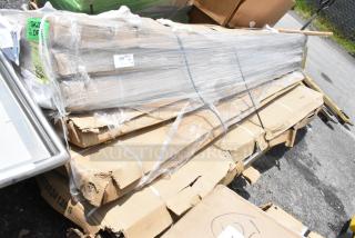 Large package wrapped in plastic, containing long metal beams. Visible labels include "335 lbs" and "SKID 2 OF X." Box corners are damaged.