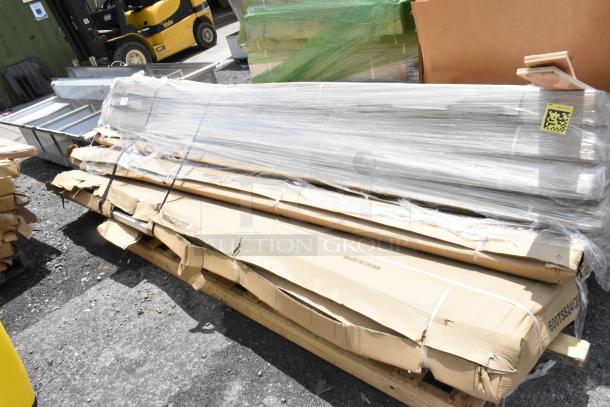 Stack of aluminum profiles wrapped in plastic and cardboard on pallet, labeled "Made in China," includes QR code.