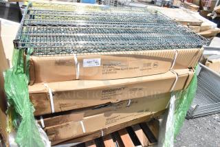 Stacked boxes of Regency wire shelves, model 24"x48" green epoxy, slightly weathered packaging, palletized for auction.