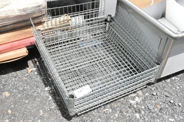 Metal wire storage basket, rectangular shape, features stacking corners. Visible label marked "33814". Good condition.