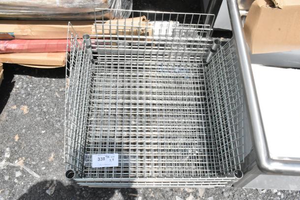 Metal wire basket in good condition, grid design, four corner support tubes. Label reads "338 1/4 QTY x4".