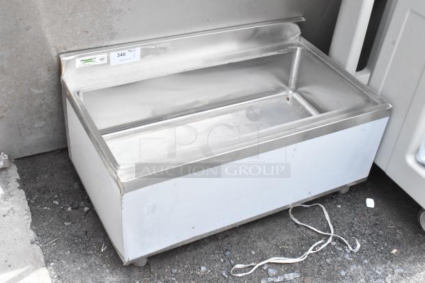 Stainless steel drop-in ice bin, Regency label visible, model 340, used condition.