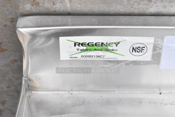 Regency stainless steel commercial sink, model 600IB2136C7, NSF certified, showing label with slight wear.