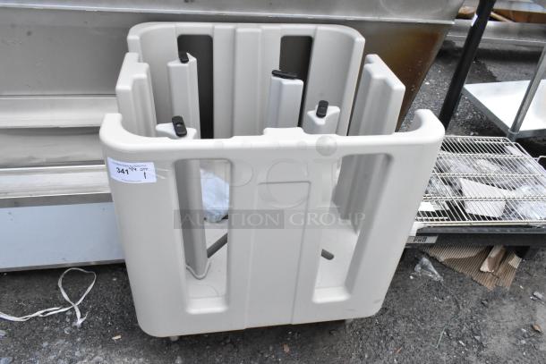 Gray plastic dish rack with multiple slots, on wheels, in used condition. Label reads "341 1 QTY 1" for auction.