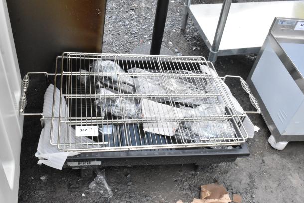 Stainless steel wire rack on a black cookware base with side handles, in used condition. Label shows "342".