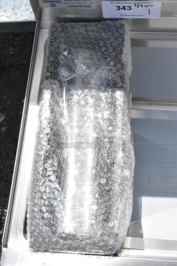 Steelton underbar ice bin, model 522UIB1836, new condition, wrapped in bubble wrap for protection.