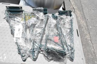 Set of four green metal wall brackets in plastic wrap, labeled "346 x4." New condition, sturdy design.