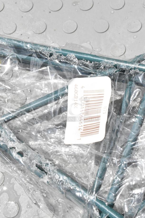 Green metal rack wrapped in clear plastic, with a visible barcode label. Appears to be new and in unopened condition.