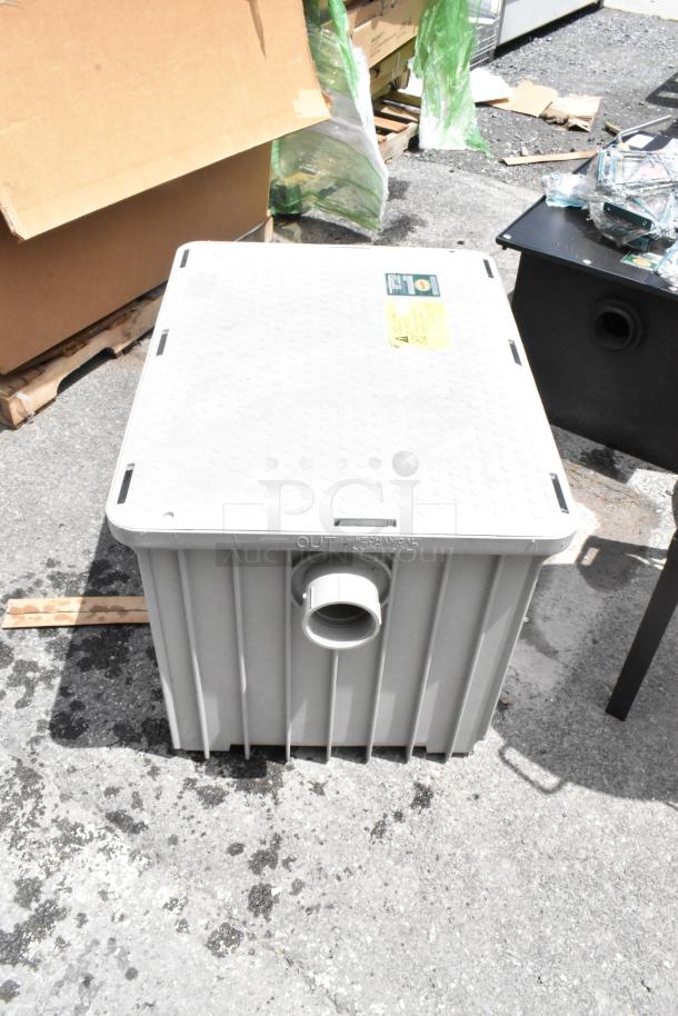 Large gray plastic tank with an outlet pipe, textured lid. Visible manufacturer label and safety marking. Good condition.