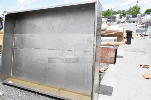 Large stainless steel industrial hood, used condition, with visible rust on exhaust vent, suitable for commercial kitchen.