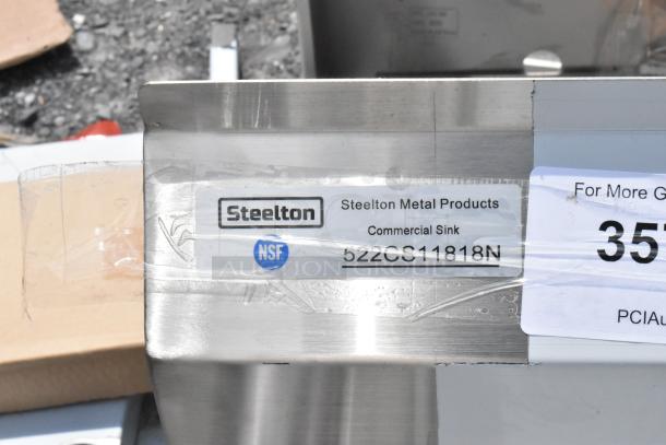 Steelton Metal Products commercial sink with NSF label and model number 522CS11818N, indicating high quality.
