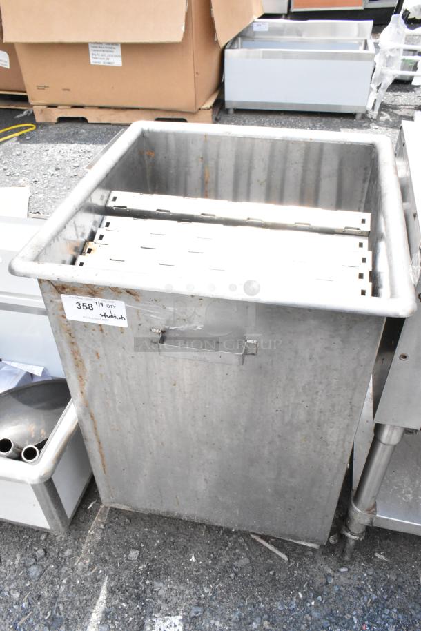 Commercial metal bin with handles, visible rust, and a label marked "358 1/4 QTY." Suitable for industrial use.