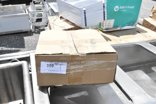 Cardboard box with label "359" and "7 QT." Visible wear, taped lid. Other boxes and trays in the background.