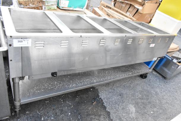 Commercial stainless steel serving station with four compartments. Good condition, auction label indicates item code 360.