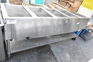 Commercial stainless steel serving station with four compartments. Good condition, auction label indicates item code 360.
