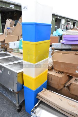 Stack of colorful plastic bins, marked 361 1 with Qty 4XL, in good condition, likely for storage or organization.