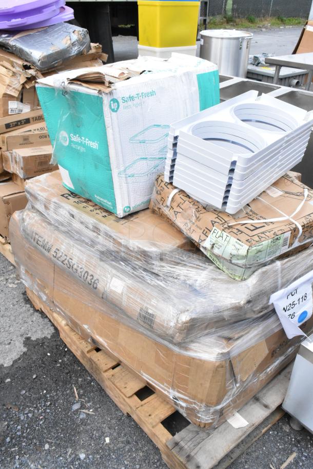 Pallet with mixed items, including Safe-T-Fresh containers and white trays, all in original packaging. Signs of wear on boxes.