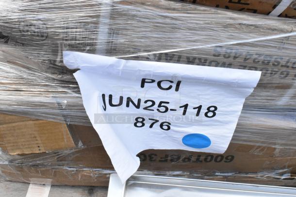 Wrapped pallet with a white label marked "PCI JUN25-118 876" and a blue dot, indicating shipment details.