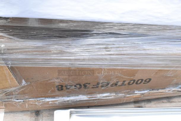 Cardboard box wrapped in plastic with visible code "600T3508". Box appears sealed and in good condition.