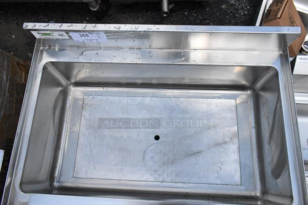 Stainless steel sink with backsplash, NSF label, dimensions 36.5" x 11". Light surface wear, one drain hole.