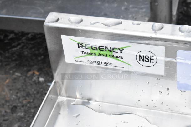 Regency stainless steel commercial sink with NSF certification. Model: 600IB2130CO, Tables and Sinks label. New condition.