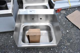 Stainless steel sink by Regency, new condition, with two faucet holes, cardboard box inside, auction tag 366 above.