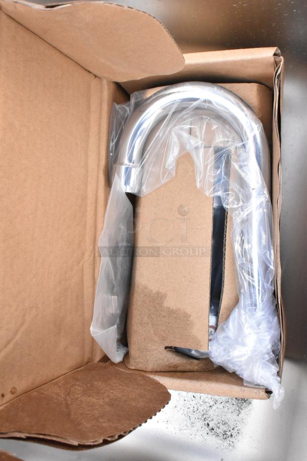 Chrome kitchen faucet, new in box, wrapped in plastic. Modern U-shape, pristine condition, ready for installation.