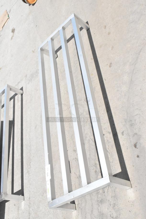 Metal support frame with five horizontal bars, sleek silver finish, excellent condition. Visible label reads "312 VAC."