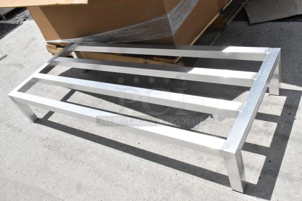 Stainless steel bench frame, durable and sleek, in excellent condition. Ideal for indoor or outdoor use. No visible labels.