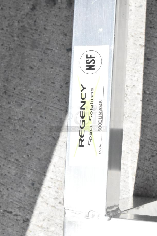 Metal frame marked "Regency Space Solutions," NSF certified, model 600DUN2048, suitable for shelving use.