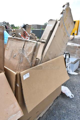 Large lot of assorted cardboard boxes, various sizes and conditions, outside on gravel. Box marked with sticker "374."