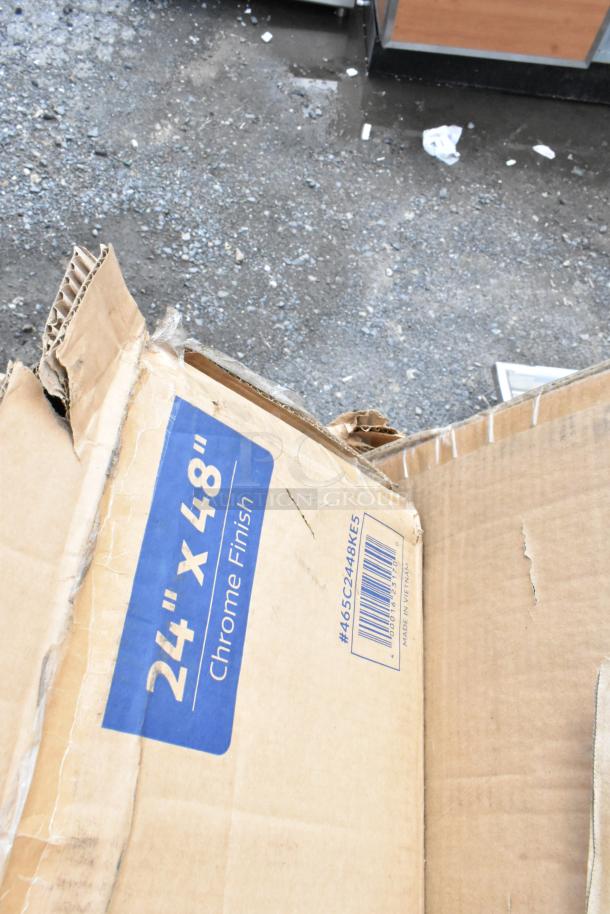 Cardboard box labeled "24 x 48 Chrome Finish," showing wear. Markings include #465C2448KES and barcode.