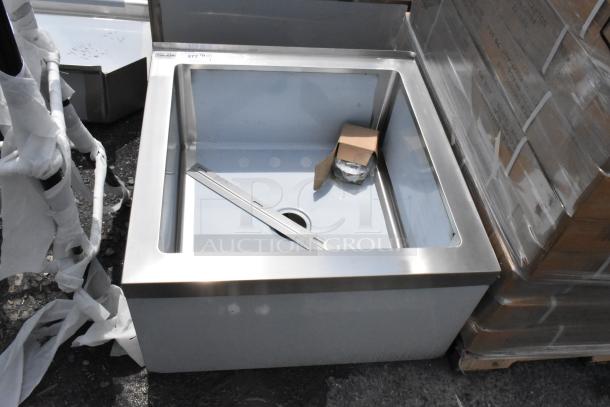 Stainless steel commercial sink, new condition, includes installation brackets and drain. Label with "377" marking.