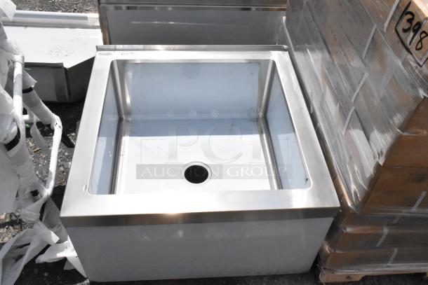 Stainless steel commercial sink; new condition, deep basin, central drain. Label with model number visible on the rim.