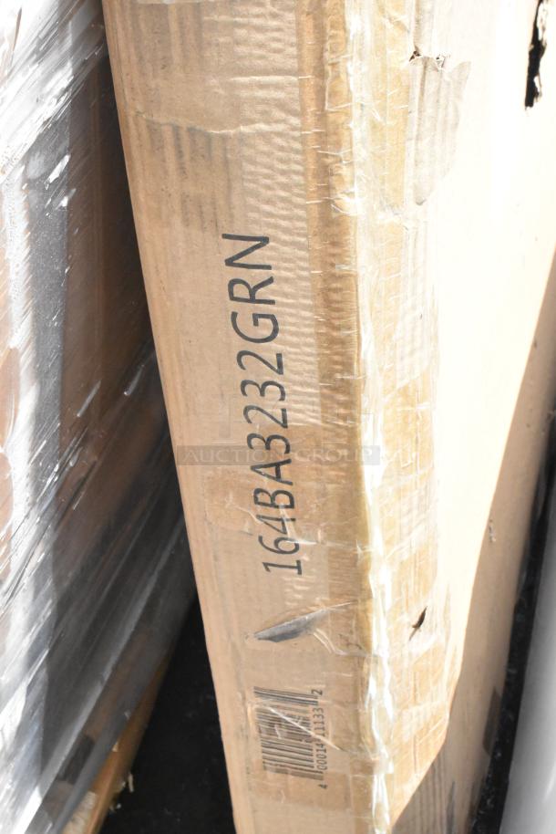Damaged cardboard box with visible label "164BA3232GRN" and partial barcode, indicating the item inside.