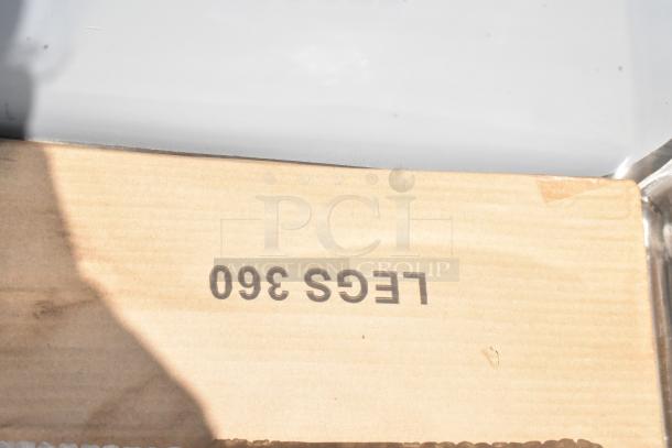 Cardboard box labeled "LEGS 360," partially open. Box shows slight wear, indicating possible storage item.