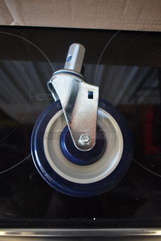 Heavy-duty metal caster wheel with swivel mount, blue and white rubber, excellent condition. Ideal for carts or furniture.